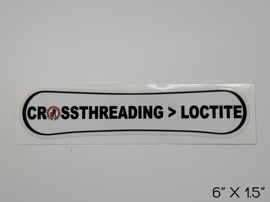 "Cross threading over loctite" snowboard shaped sticker with Boardworks Tech Shop Logo. Size: 6 inches by 1.5 inches. 