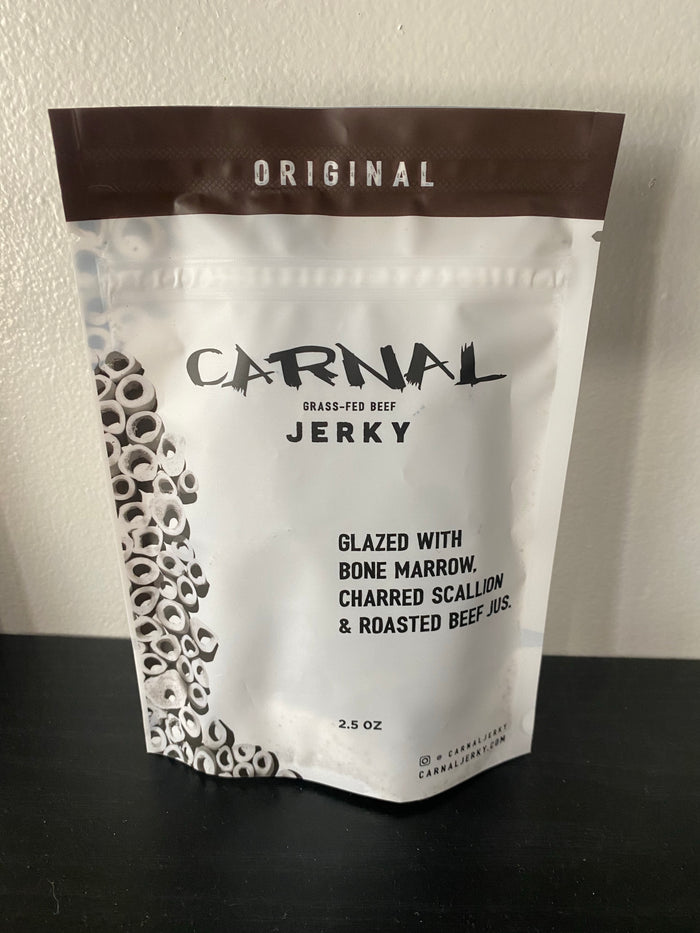 Original flavor Carnal Jerky package. Grass fed beef. Glazed with bone marrow, charred scallion & roasted beef nuts. Size: 2.5 o.z.